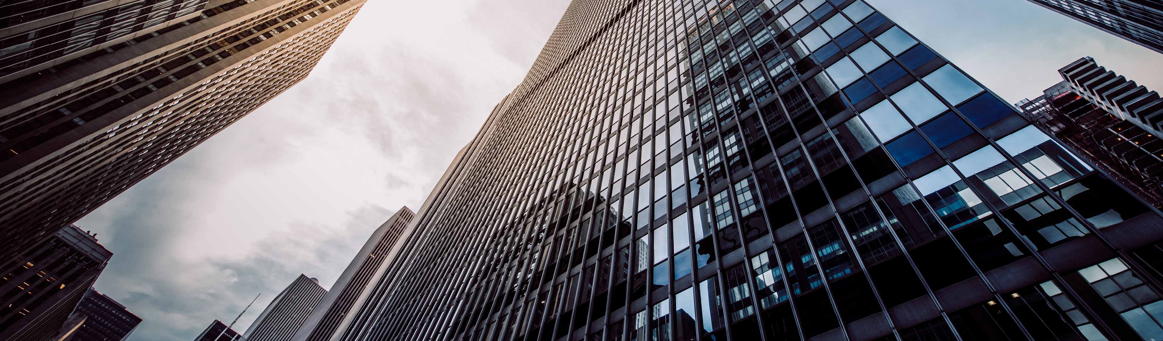 looking up at skyscrapers