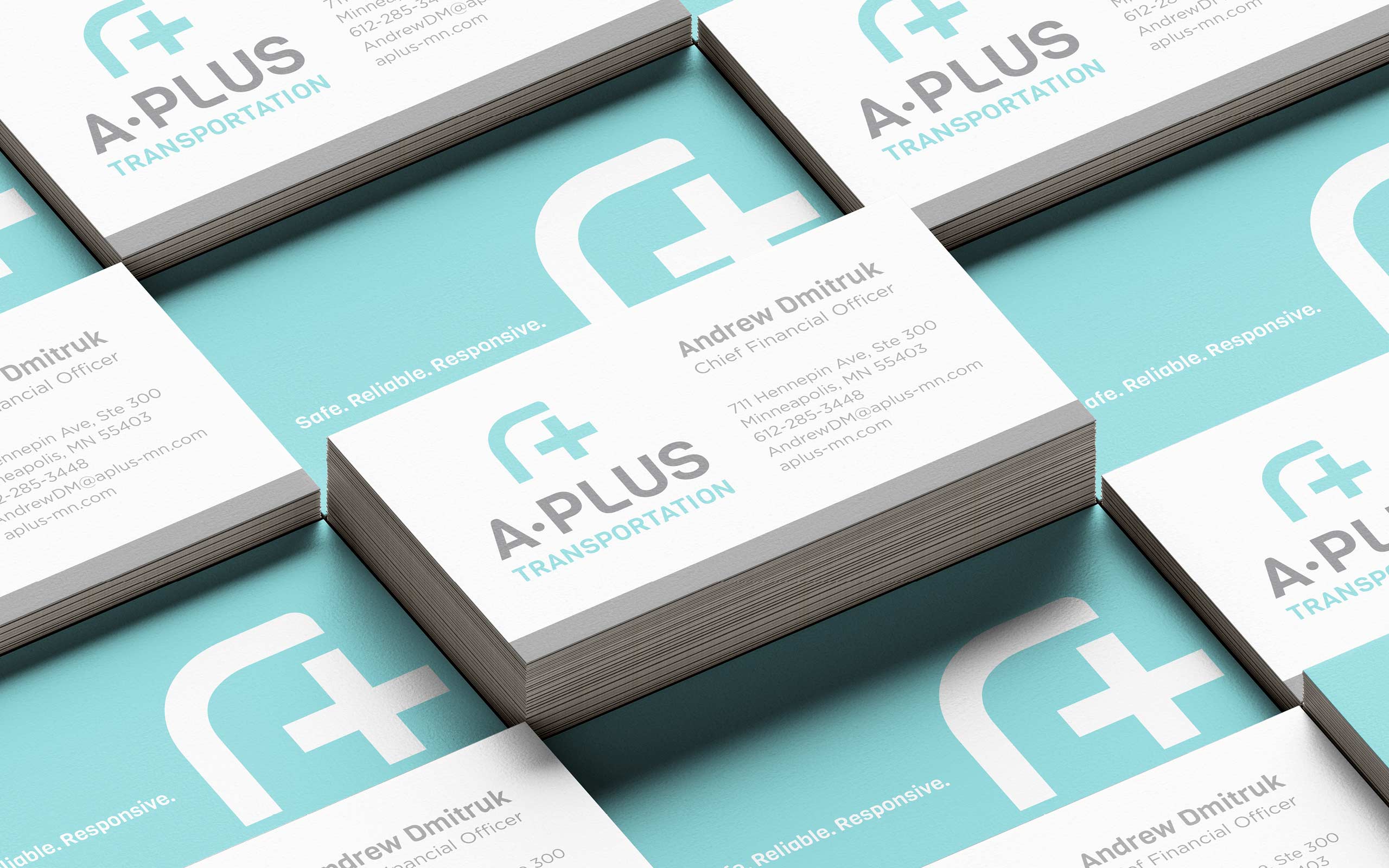 Stacks of A-Plus business cards, arranged in a grid.