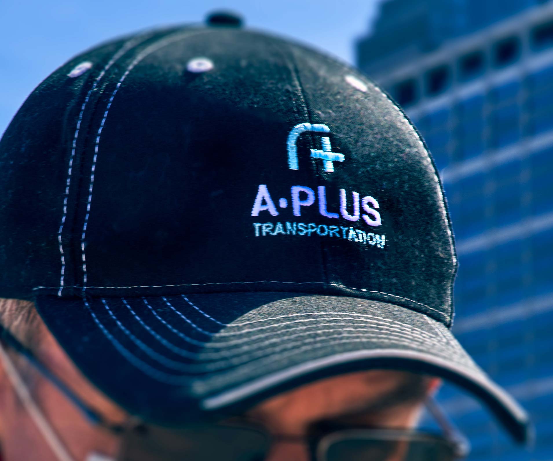 The A-Plus logo embroidered on an employee hat.