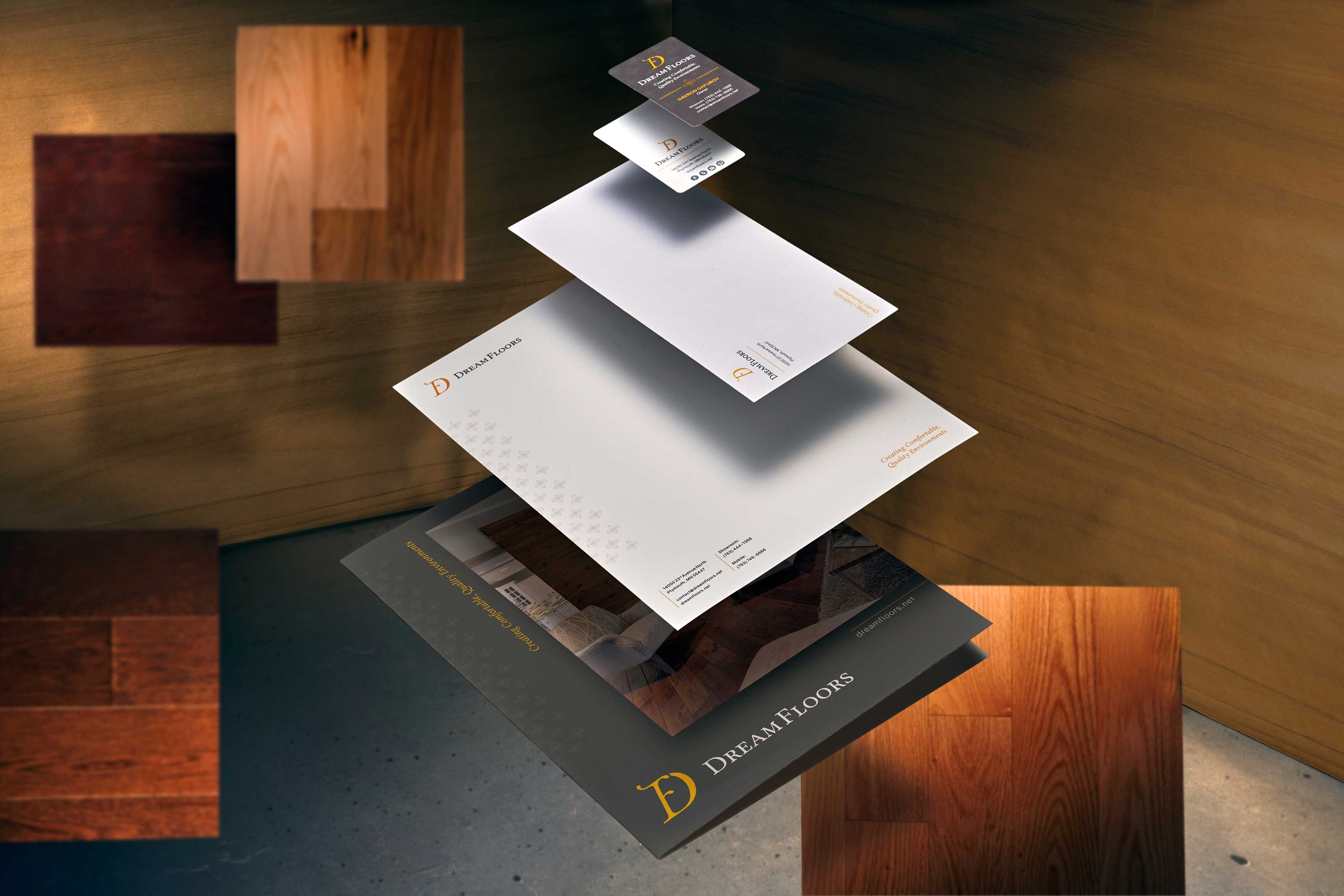 The Dream Floors collateral system, floating in a dream-like space, consists of business cards, envelopes, letterhead and a pocket folder.