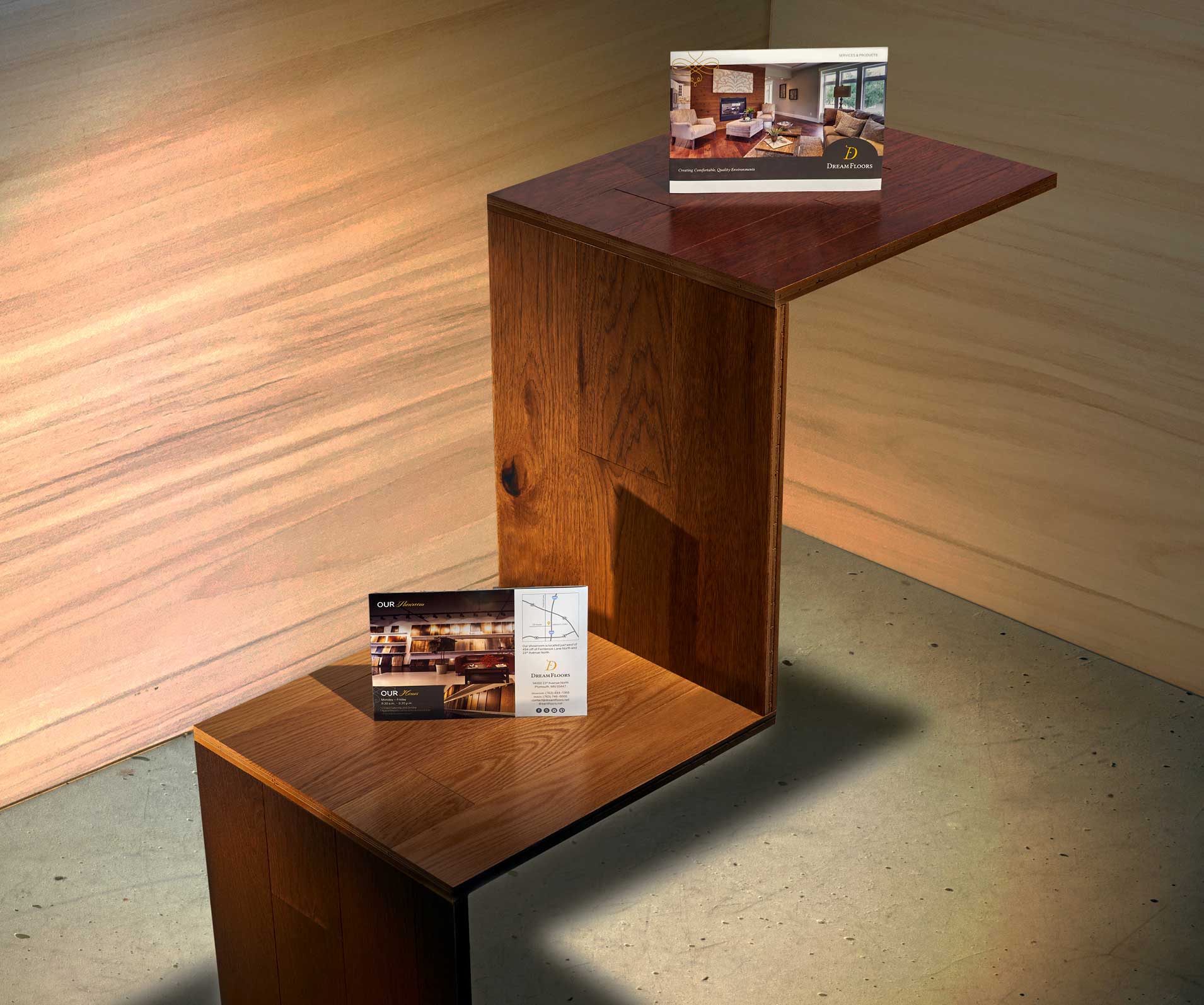 The Dream Floors brochure cover and back side sit on a staircase built out of flooring panels.