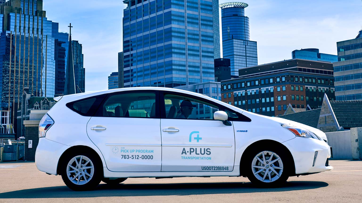 A-Plus Transportation vehicle graphics.